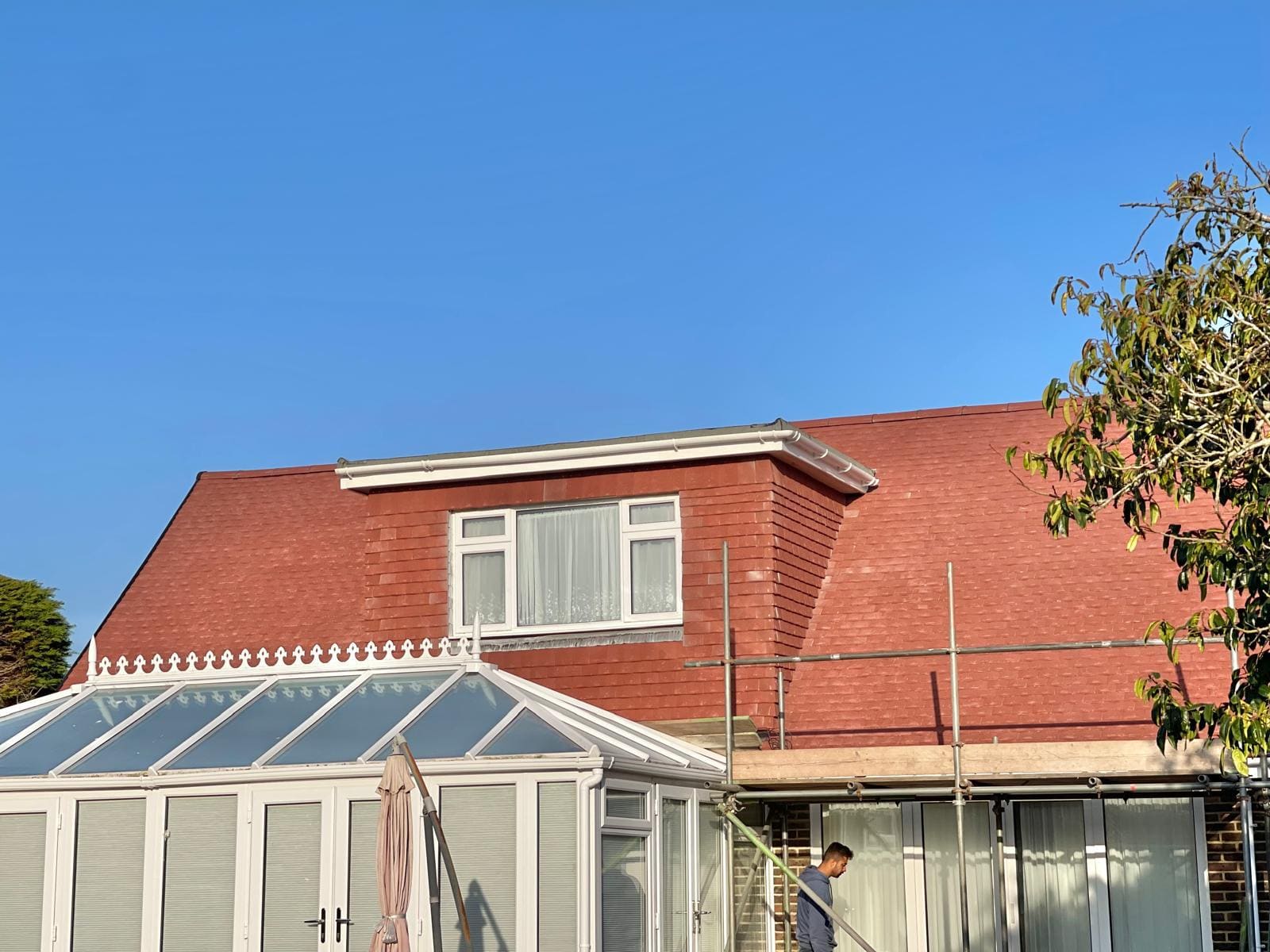 New red tiled roof dormer scaffold