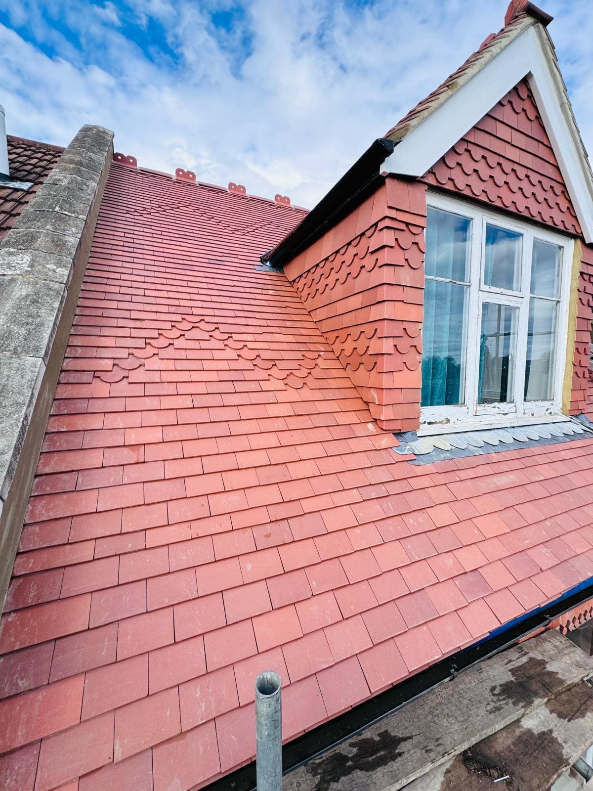 Red tiled roof twin dormers