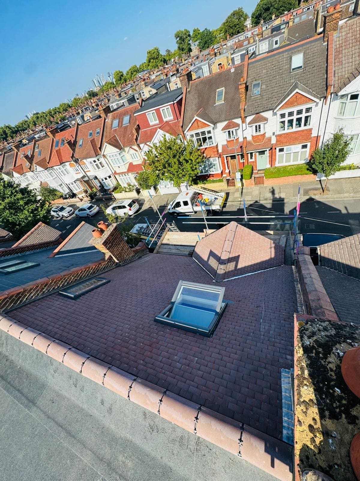 Dark tiled roof velux aerial
