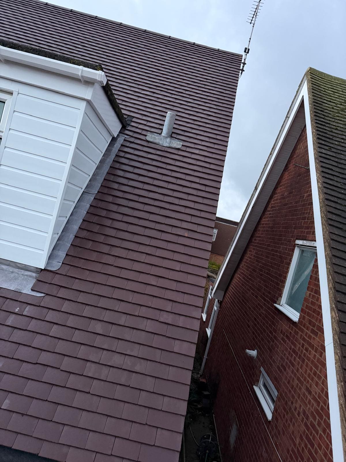 White clad dormer tiled roof