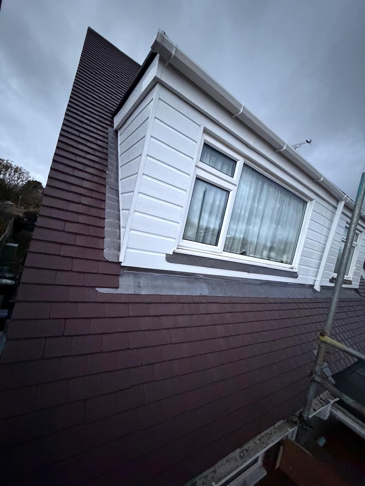 Dark tiled dormer white window