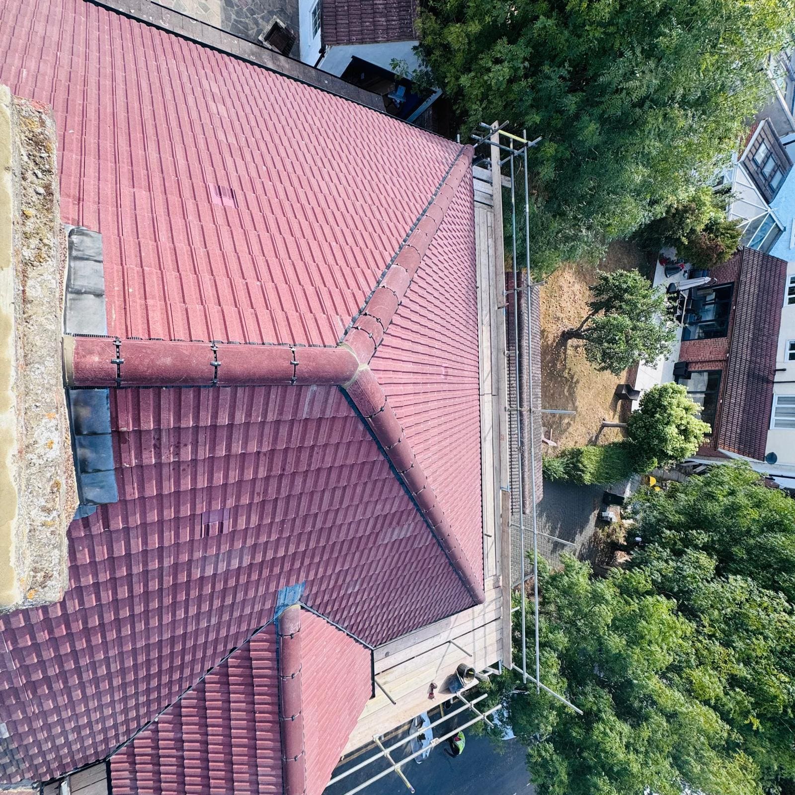 Red tiled roof scaffolded